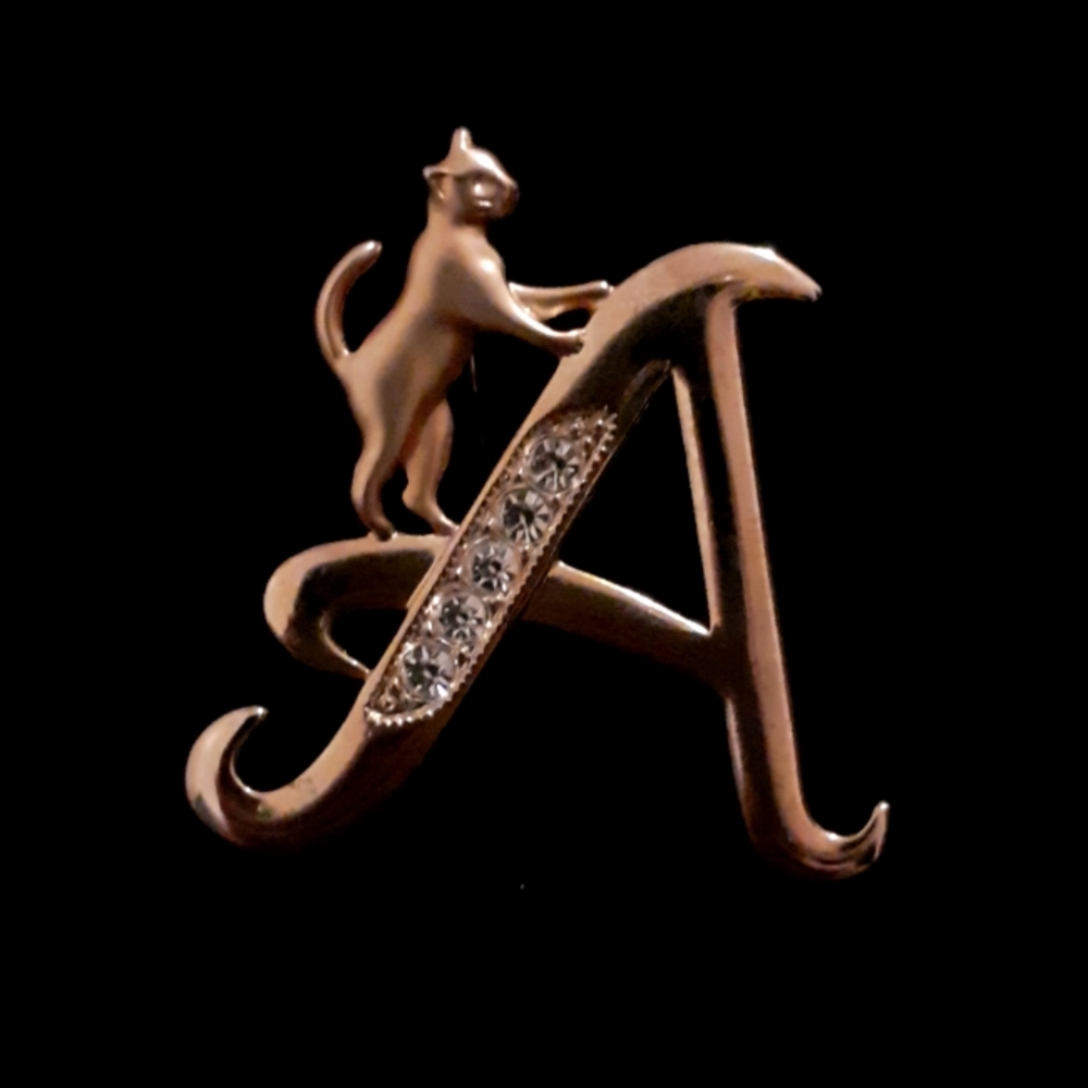 Monogram brooch